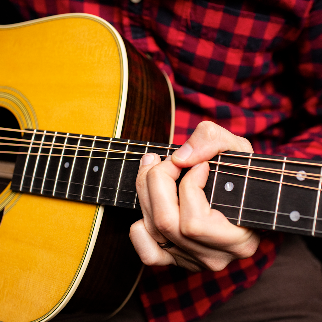 Person playing guitar